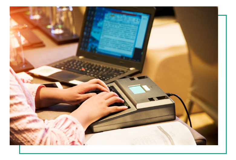 person typing on typewriter